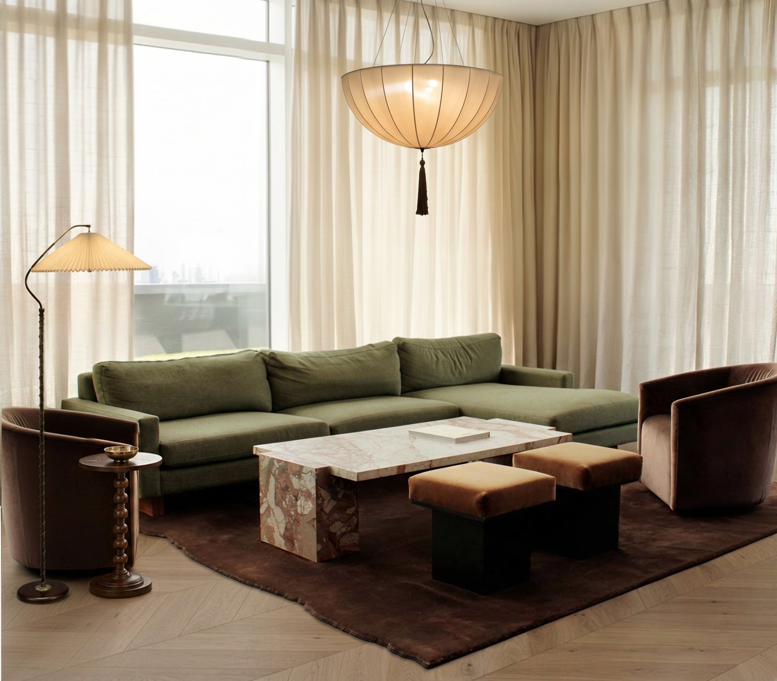 Living room with an olive sectional, marble coffee table, velvet armchairs and a silk pendant lamp